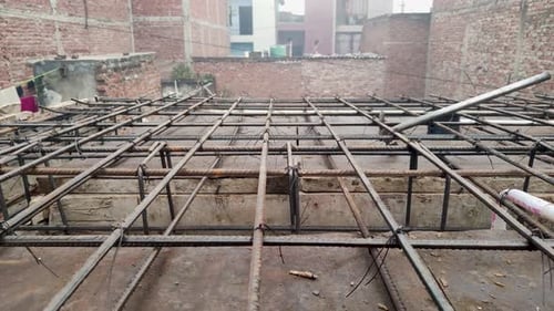 12-1-24;Iron steel rods form rows and columns in the under-construction building