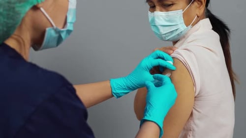 Healthcare Worker Giving Injection to Patient