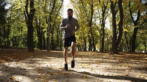 Man Doing Cardio Warmup in the Park