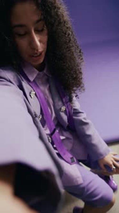 Young Biracial Fashion Model Showing Her Designer Outfit in Photo Studio