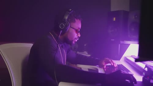 African American Audio Engineer Working in Recording Studio