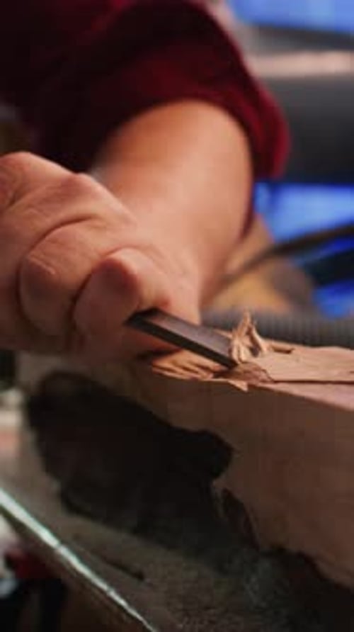 Vertical Video Manufacturer in Studio Shaping Wooden Pieces with Tools Close Up