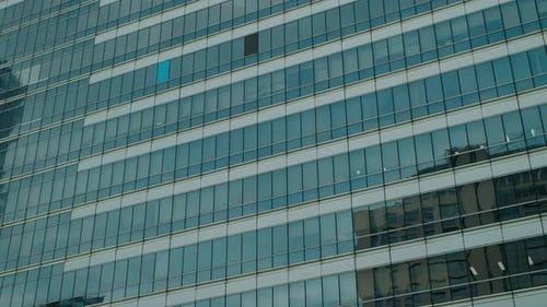 Glass Facade of Modern Office Building CloseUp Bangkok Thailand