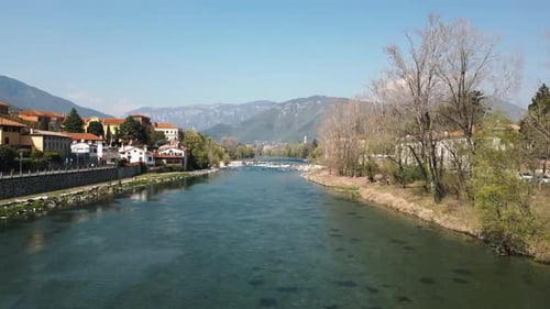 A Scenic River View with Magnificent Mountains in the Background Creating an Idyllic Atmosphere
