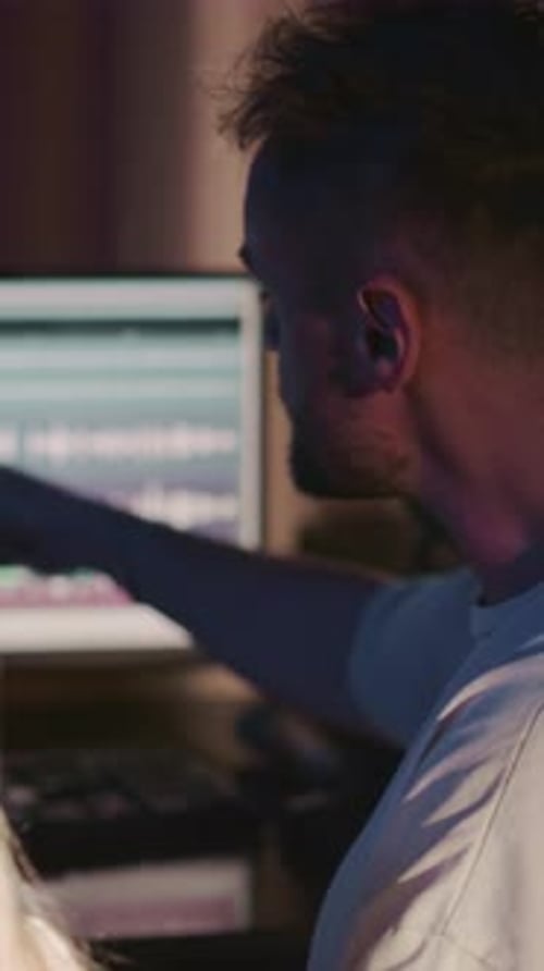 Kid with Instructor in Recording Studio