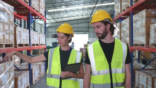 Both of employees in an auto parts warehouse,