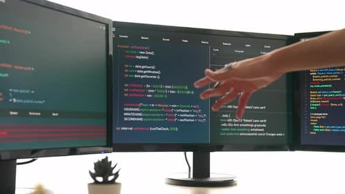 Slow motion back end software developer engineer writing code. Burgeoning