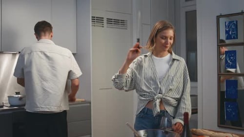 Wife Preparing Romantic Dinner for Family Couple Exchanging Cooking Utensil