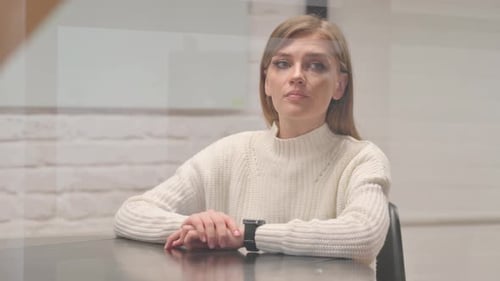 Waiting Young Woman Checking time on Watch at Workplace