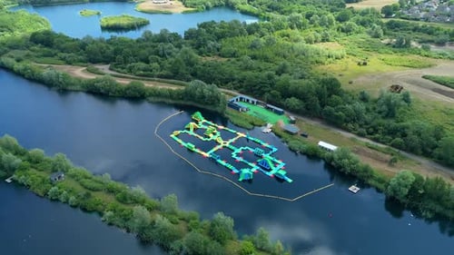 Aerial View of a Colorful Water Park in a Serene Lake