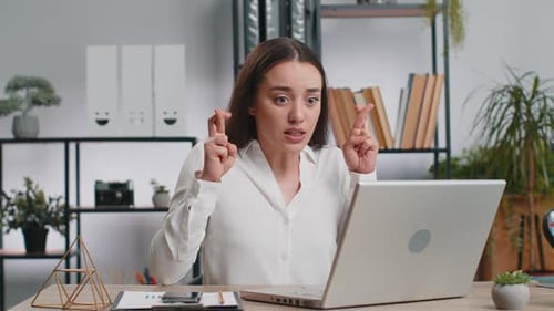Brunette Woman Anxious and Frustrated at Laptop