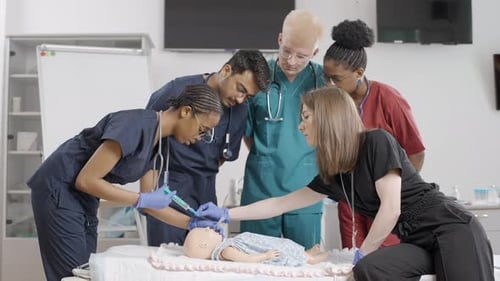Medical Team Practices on Baby Mannequin