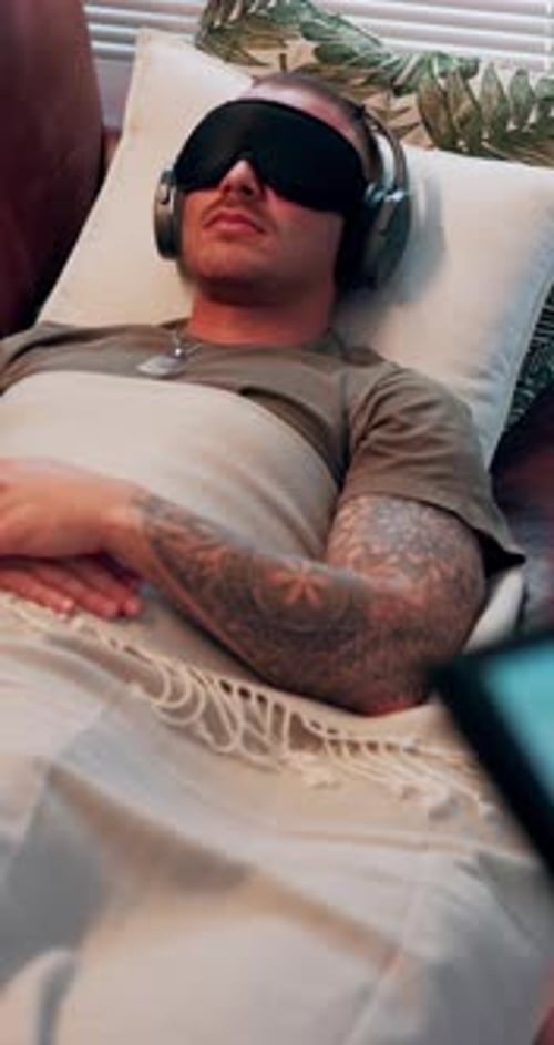 Audio therapy, sofa and soldier with headphones and eye mask for depression, anxiety and wellness