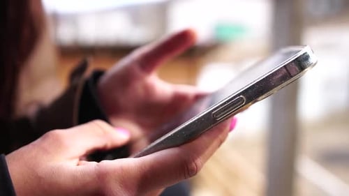 Woman Hand Using Smartphone Mobile App with Touch Screen