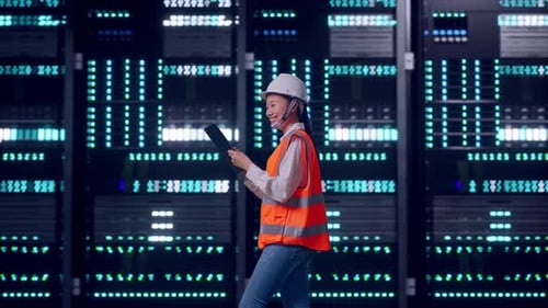 Asian Female Use Tablet While Walking in Data Center