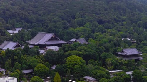 Aerial View of a Traditional Temple in Kyoto Surrounded By Forest