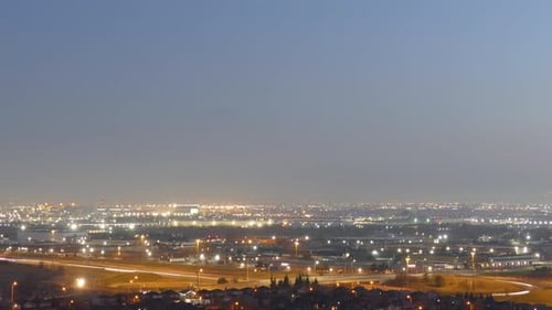 timelapse of Toronto city illuminated and vehicle traffic on the highway at sunset time. panoramic