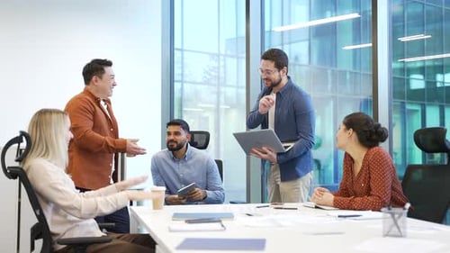 Professionals Collaborating During Office Meeting in Modern Workplace