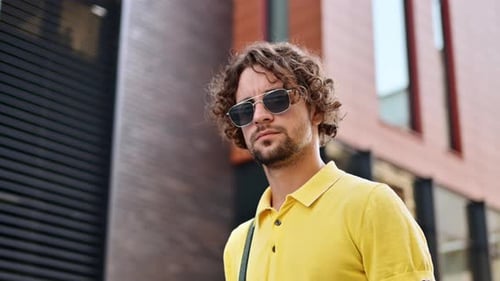 Stylish Man With Sunglasses in Urban Setting