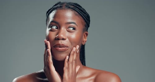 Laugh, smile and skincare with face of black woman in studio for self care, beauty and shine