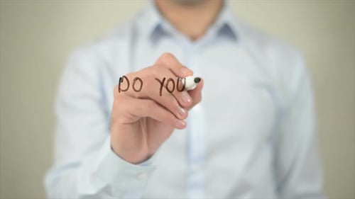 Do You Know Your Customer Right Man Writing on Transparent Screen