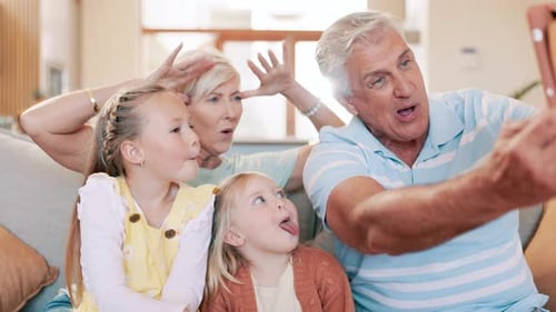 Family Making Silly Faces for a Selfie