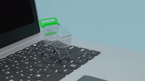 Miniature Shopping Cart on Laptop Keyboard