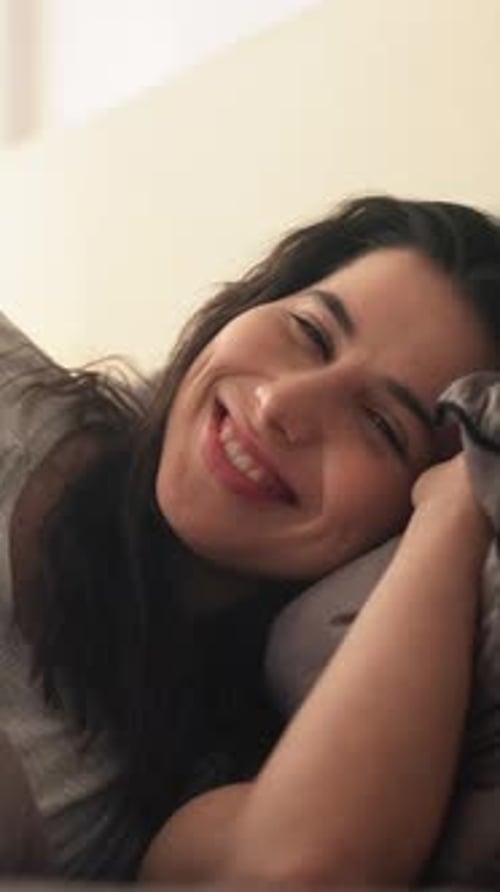 Woman Smiling in Bed, Close Up Shot