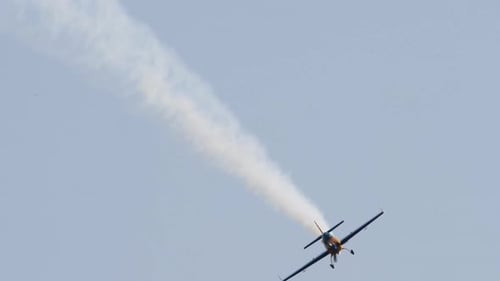 Airplane Performs an Aerial Stunt With Smoke Trail