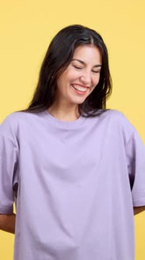 Happy Woman Holding Out a Birthday Gift