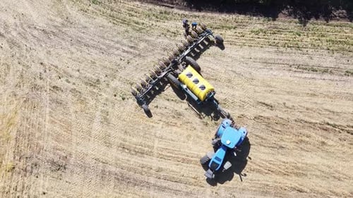 Blue Tractor O.A. Planting Canola On No Till Field