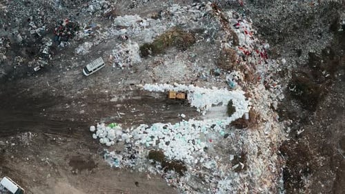 Aerial View of Garbage Pile in Trash Dump Bulldozer Woving Waste on Landfill Biohazard for Ecosystem
