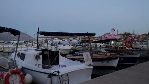 Boats moored in a marina at evening