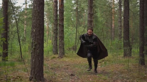 Knight in Chain Mail Runs to Attack with Sword