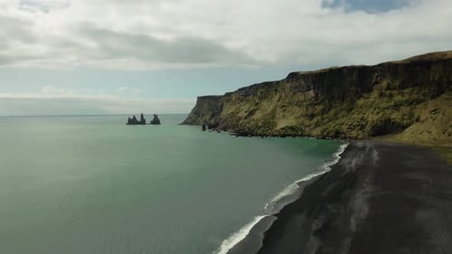 Black Sand Beach and Reynisdrangar Rocks In Iceland