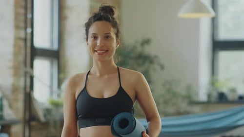 Portrait of Happy Woman in Yoga Studio