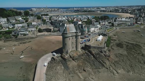 Beach and Solidor tower, Saint-Malo city in background, Brittany in France. Aerial drone panoramic v
