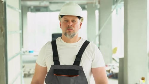 Confident 40s Builder Engineer Architect Walk on a Construction Site Construction Worker at Modern