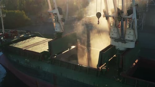 Aerial of Wheat Loading to Bulker Ship Cargo Hold at Sea Grain Elevator in Sea Port Wheat Pouring