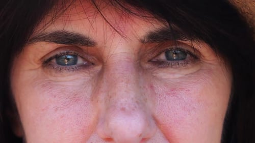 Close Up to Upset Female Face Looking Into Camera with a Disappointing Sight Upset Facial Expression