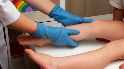 Pediatric Examination of Child's Leg in Clinic