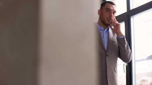 Professional Man in Suit Talking on Phone Inside