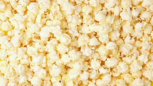 Popcorn Stop Motion Video on Bright Yellow Background Popcorn Changing Background Junk Food or Snack