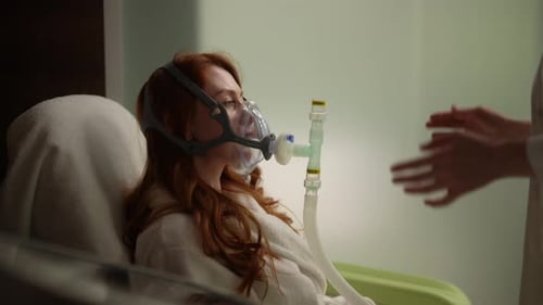 Woman Wearing Mask Receiving Respiratory Treatment