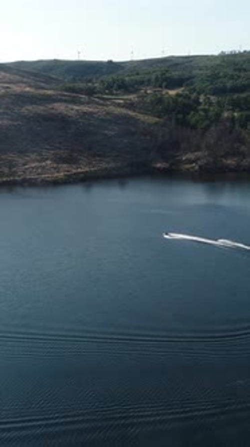 Vertical Video of Speed Boat on the River