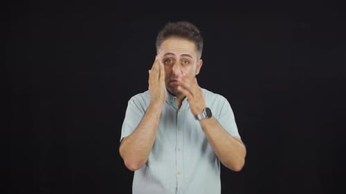 Man with wrinkles and problems on his skin is unhappy.