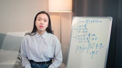 Young Woman Giving a Math Lecture at Home