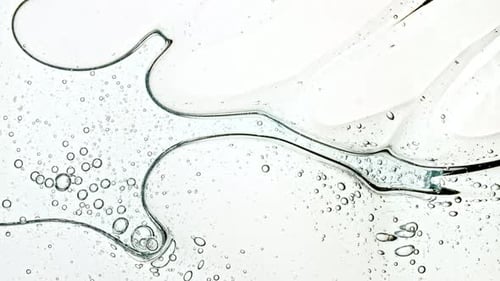 Abstract Clear Liquid with Bubbles Rippling