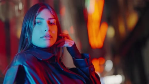 Glamorous Woman Posing at Night in Urban Setting