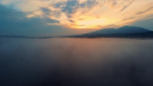 Sunset And Fog